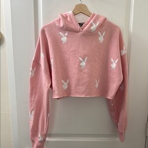 Playboy x Missguided cropped pink hoodie with bunny print (pants separate).